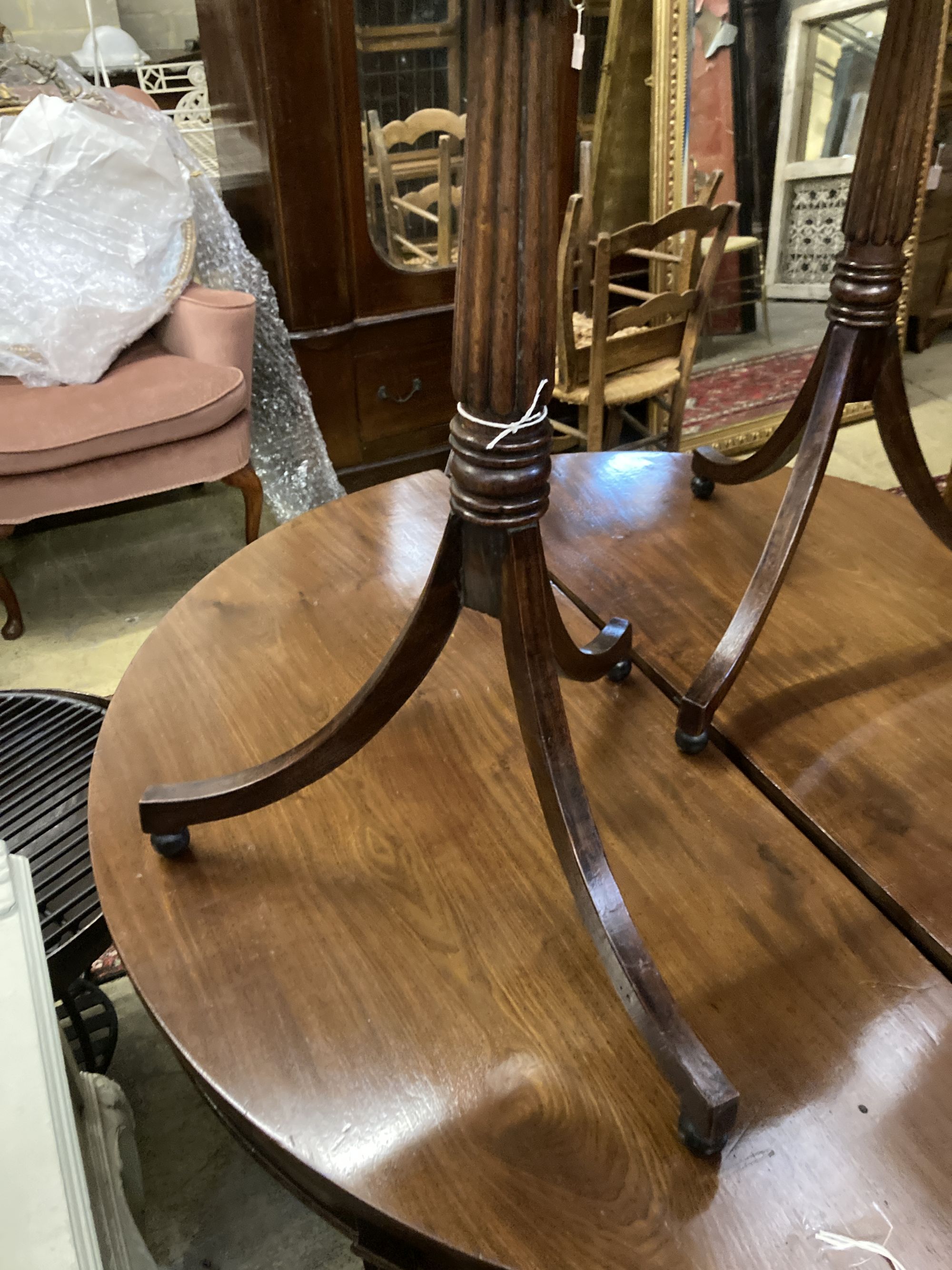 A pair of Regency style octagonal mahogany tripod wine tables, width 44cm depth 38cm height 72cm